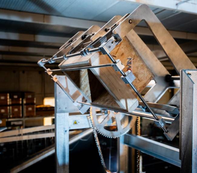 Tote being emptied by the Movin industrial tilter to transfer powder into the blending system