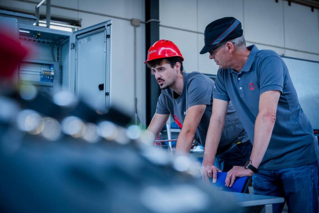 Specialist technicians used in testing the electrical picture of a machine with industrial automation manufactured and designed internally by Movin
