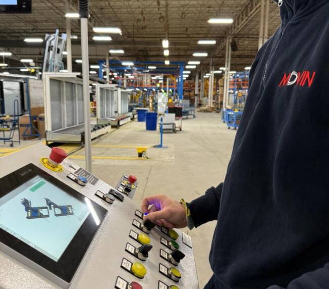 Movin operator commissioning the assembly line for commercial display cabinets, controlling the plant through the Movin HMI panel