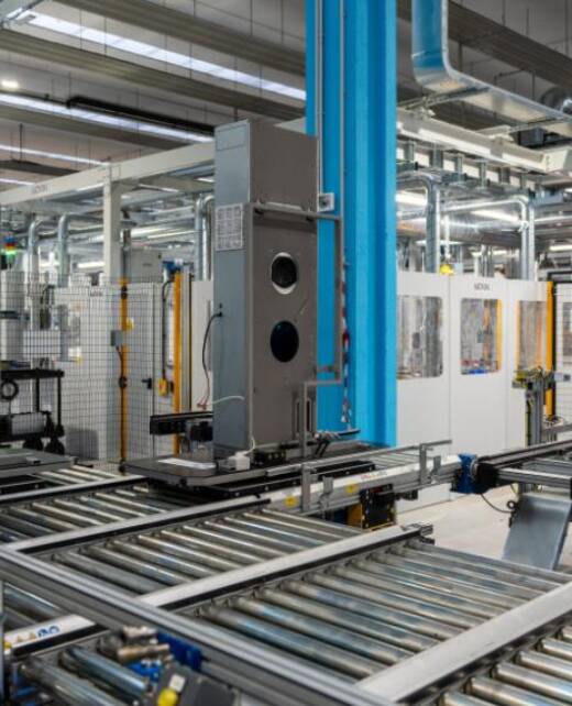 Automatic refrigerant gas charging stations inside the HVAC production line, with products conveyed on ATEX-compliant transport systems