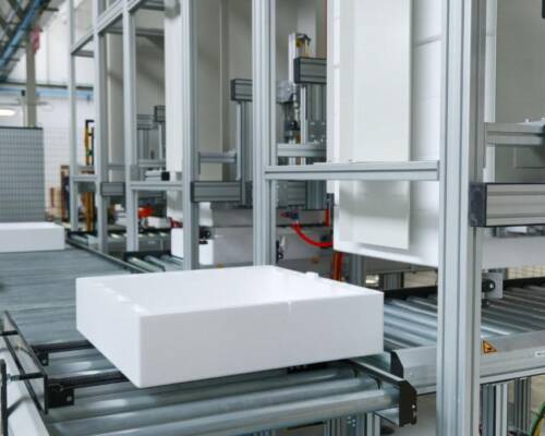Storage area for polystyrene and cardboard packaging bases used to pack the home appliances assembled along the production line
