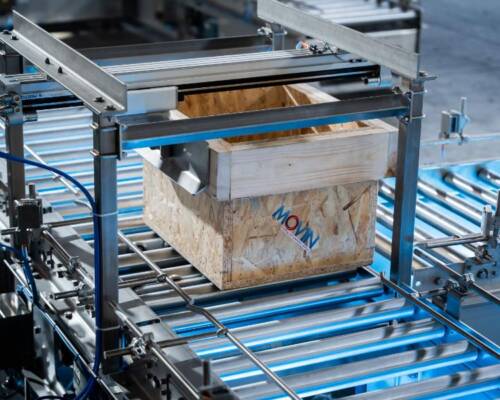 Powder-filled tote moving on a Movin roller conveyor built with solid, antistatic and dissipative motorized rollers suitable for ATEX environments