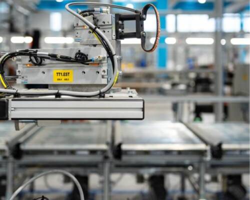 Electrical test probe mounted on the Movin assembly line for in-line electrical testing of the HVAC product during production